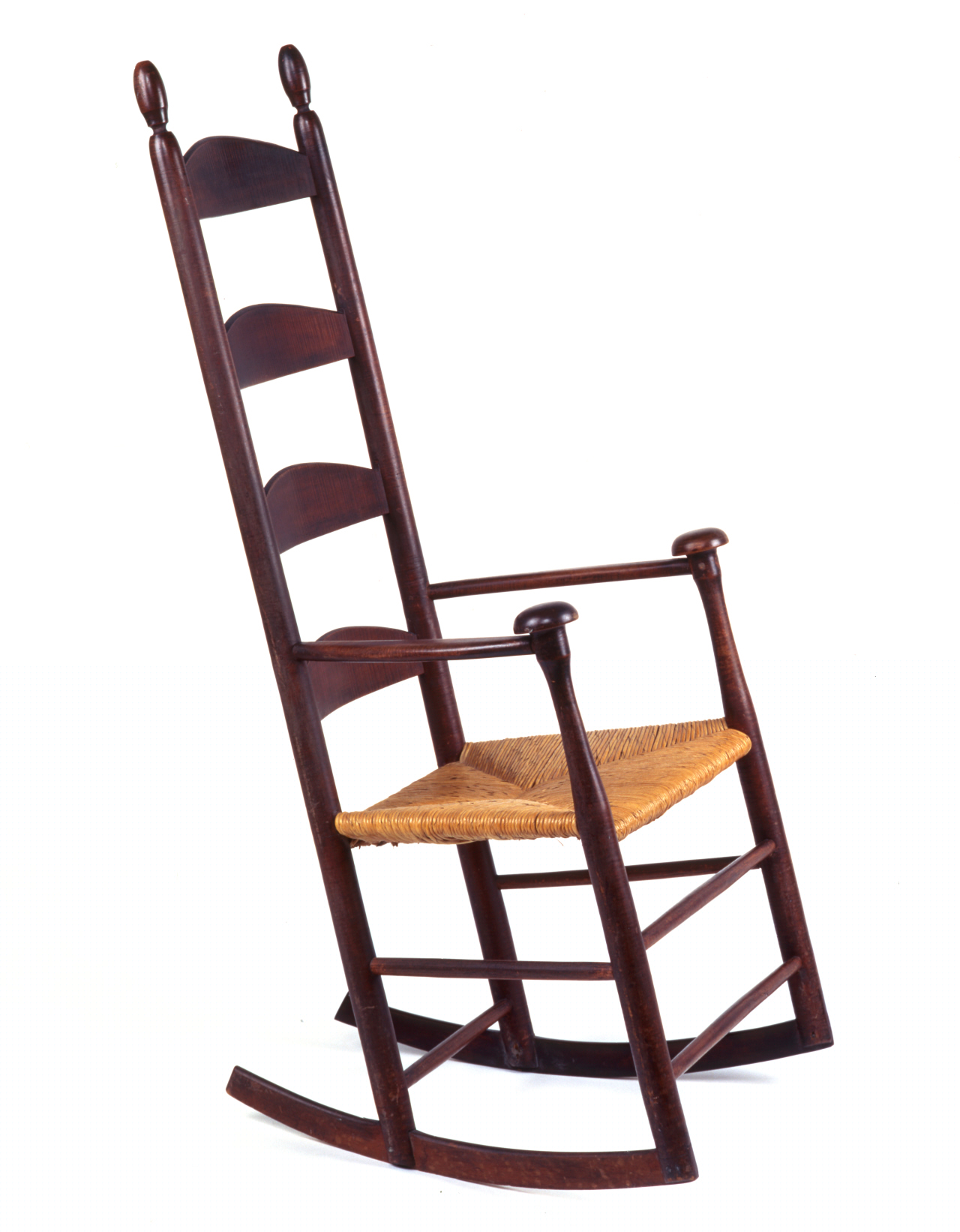 A wooden rocking chair on a white background.