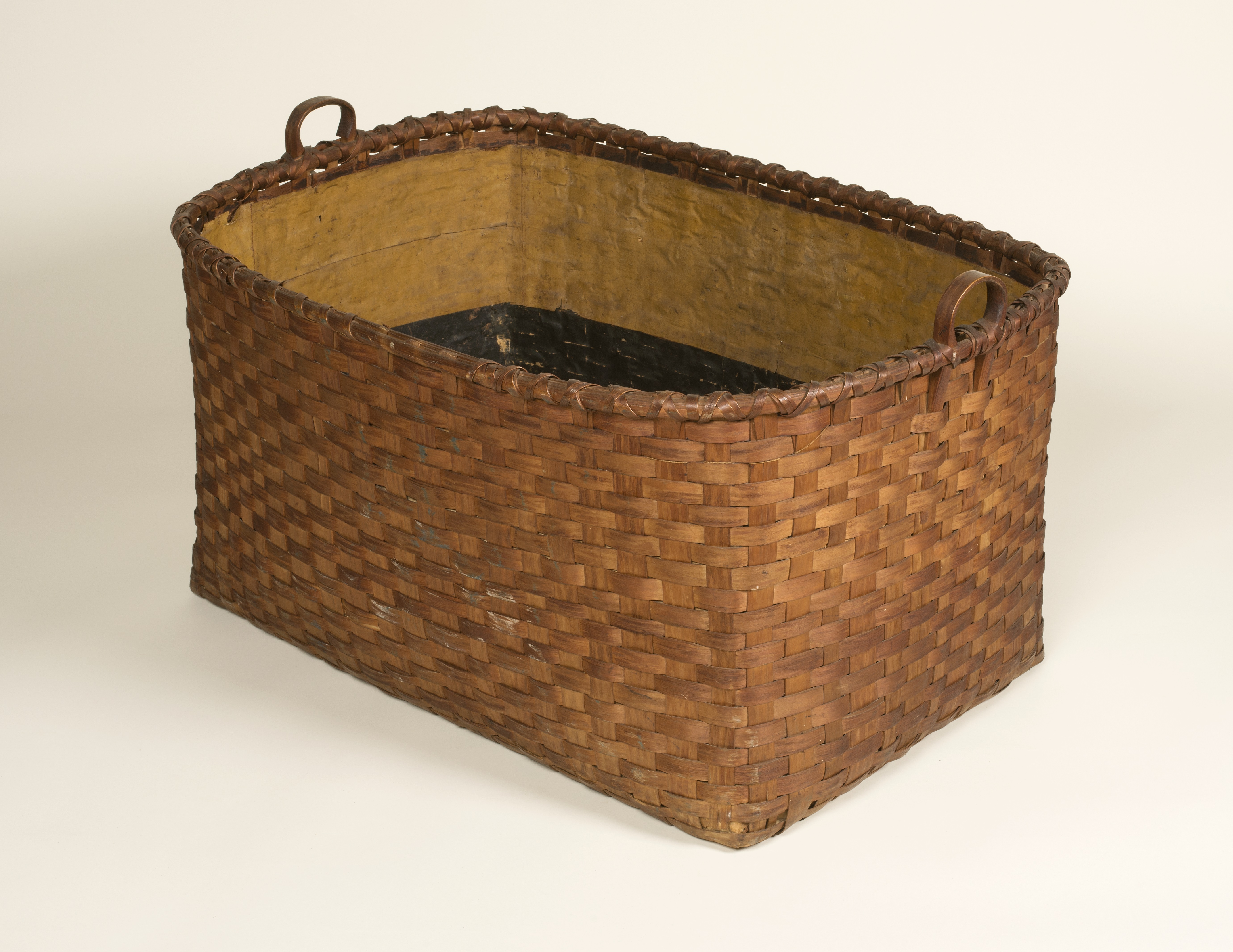 A wicker basket on a white background.