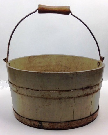 An old metal bucket with a wooden handle.