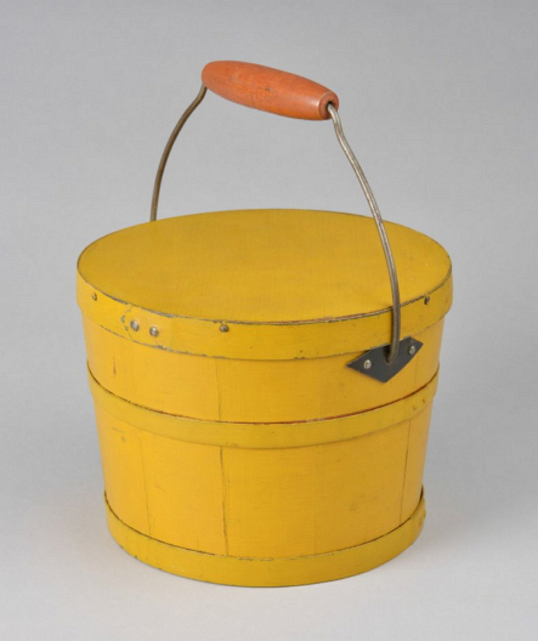A yellow bucket with an orange handle.