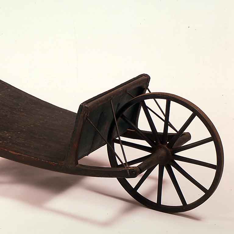 A wooden cart with a wooden seat.