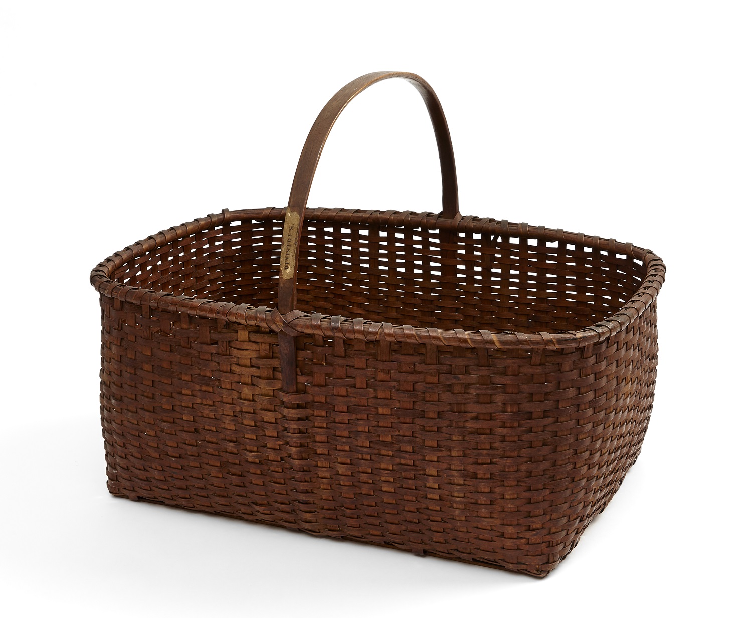 A brown wicker basket on a white background.