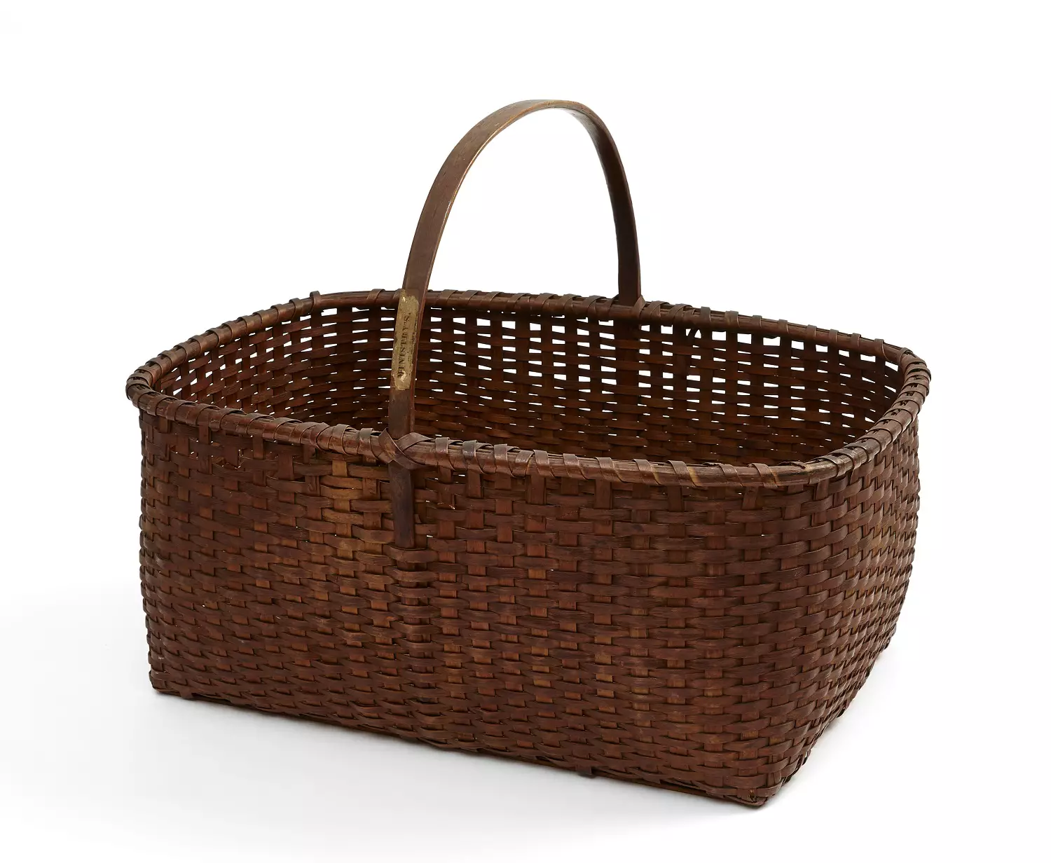 A brown wicker basket on a white background.