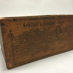 A wooden box with the words shavey laundry soap on it.