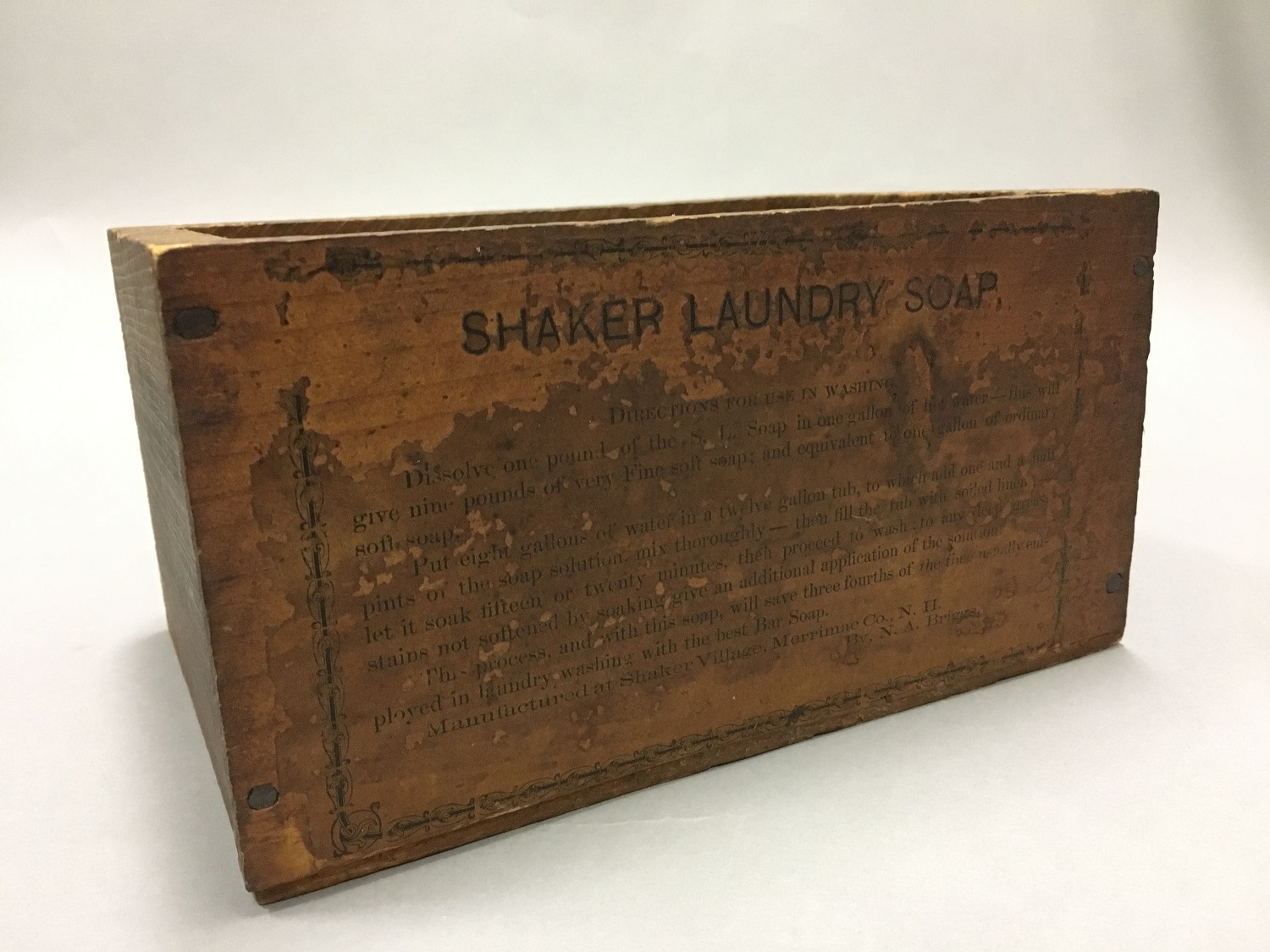 A wooden box with the words shavey laundry soap on it.