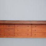 An old wooden desk with drawers on it.