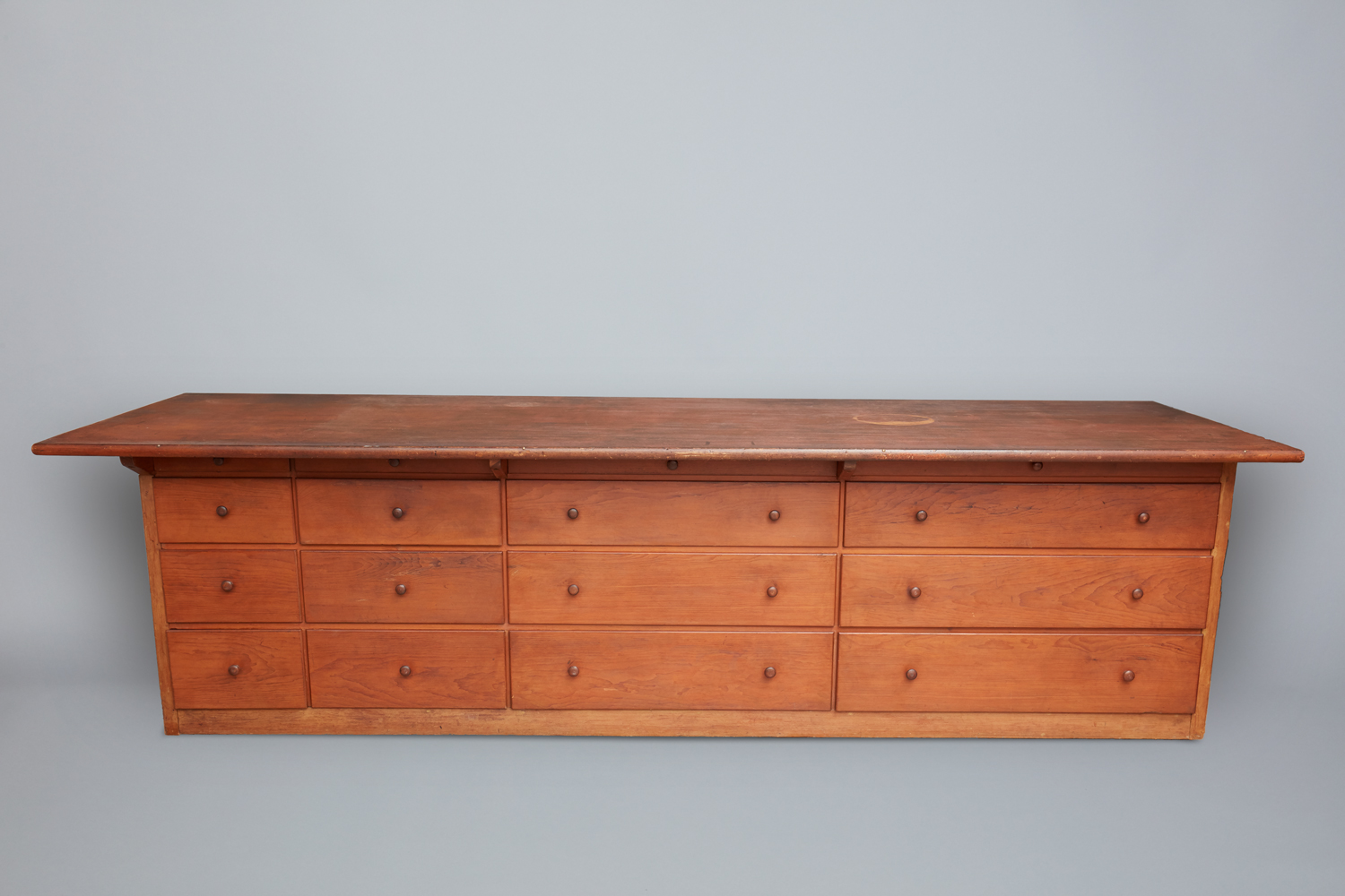 An old wooden desk with drawers on it.