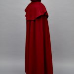 A red cloak on a mannequin.