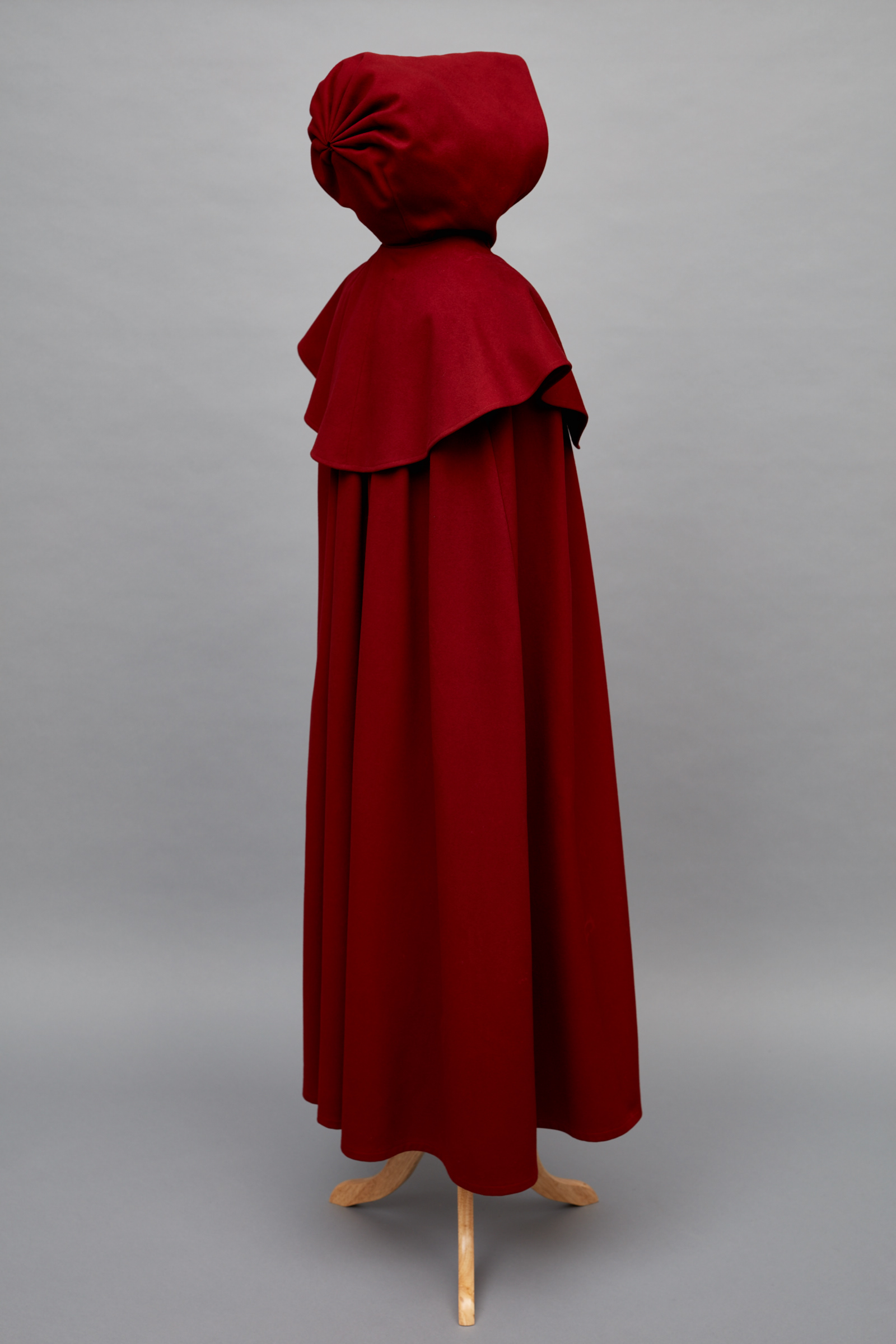 A red cloak on a mannequin.