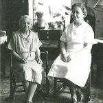 Two women sitting in a room.