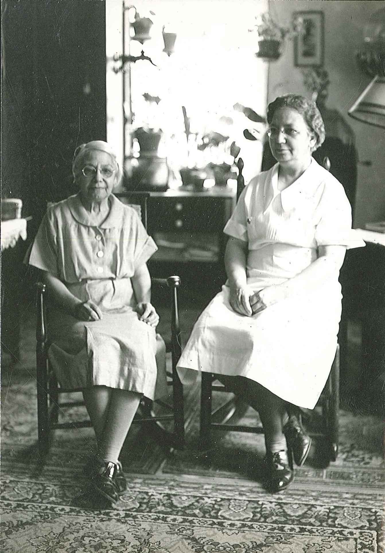 Two women sitting in a room.