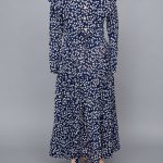 A blue and white floral dress on a mannequin.