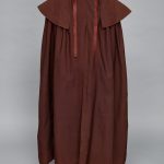 A brown cloak on a mannequin.