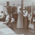 A group of women working in a sewing room.