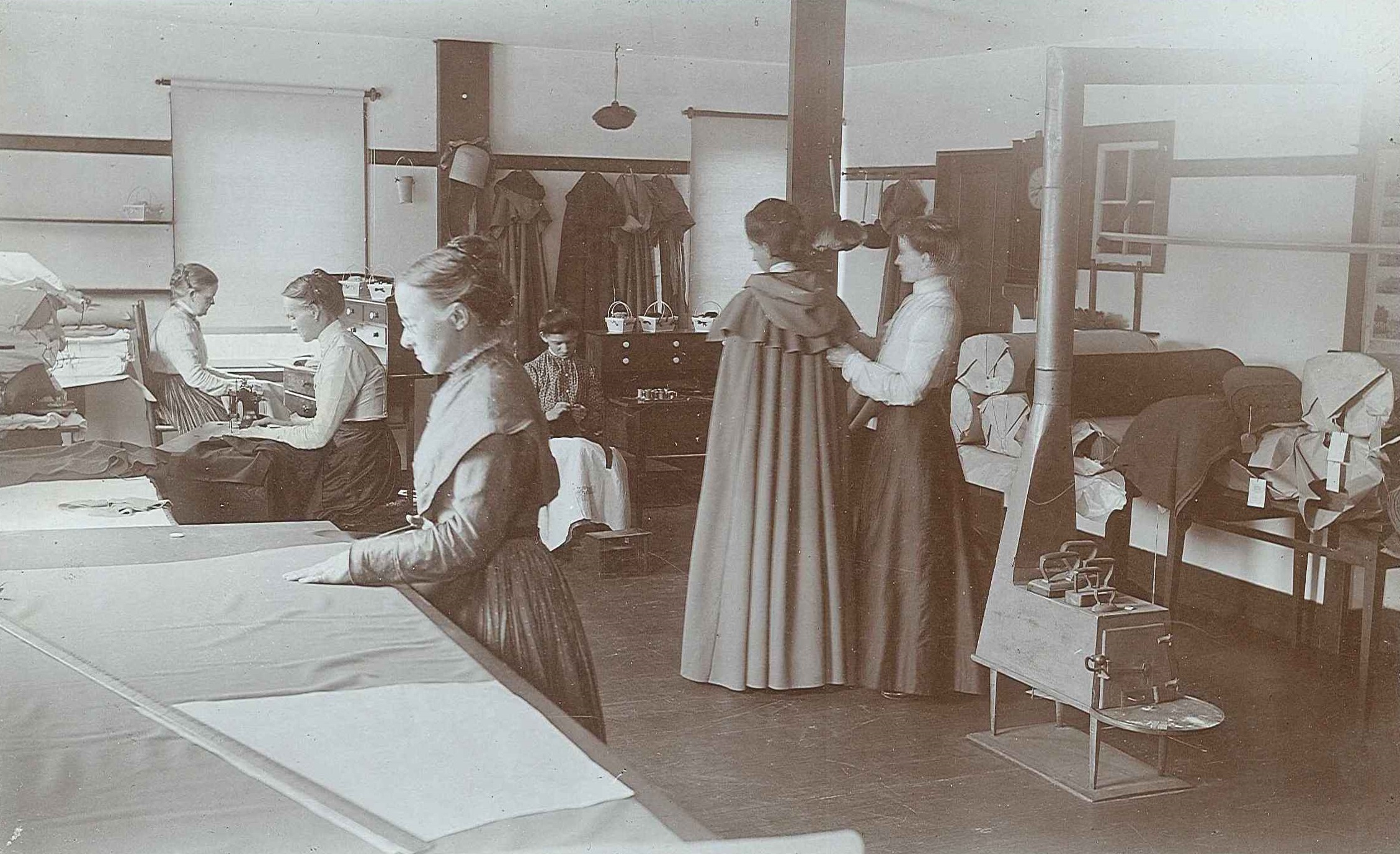 A group of women working in a sewing room.
