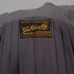 A grey jacket with a label on it.