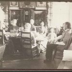 A group of people sitting around a table.