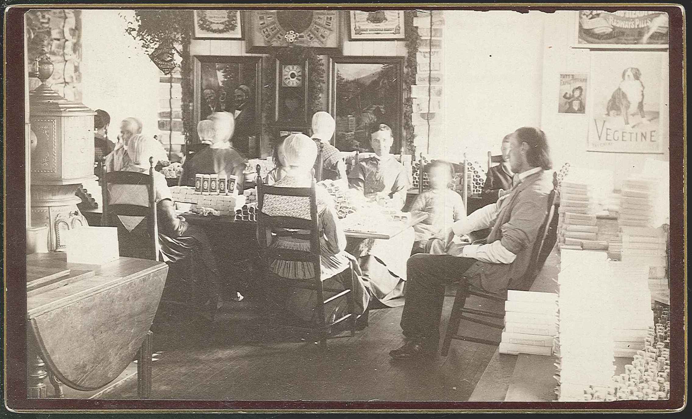 A group of people sitting around a table.