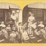 A photo of a group of women in a classroom.