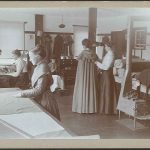 A group of women working in a sewing room.