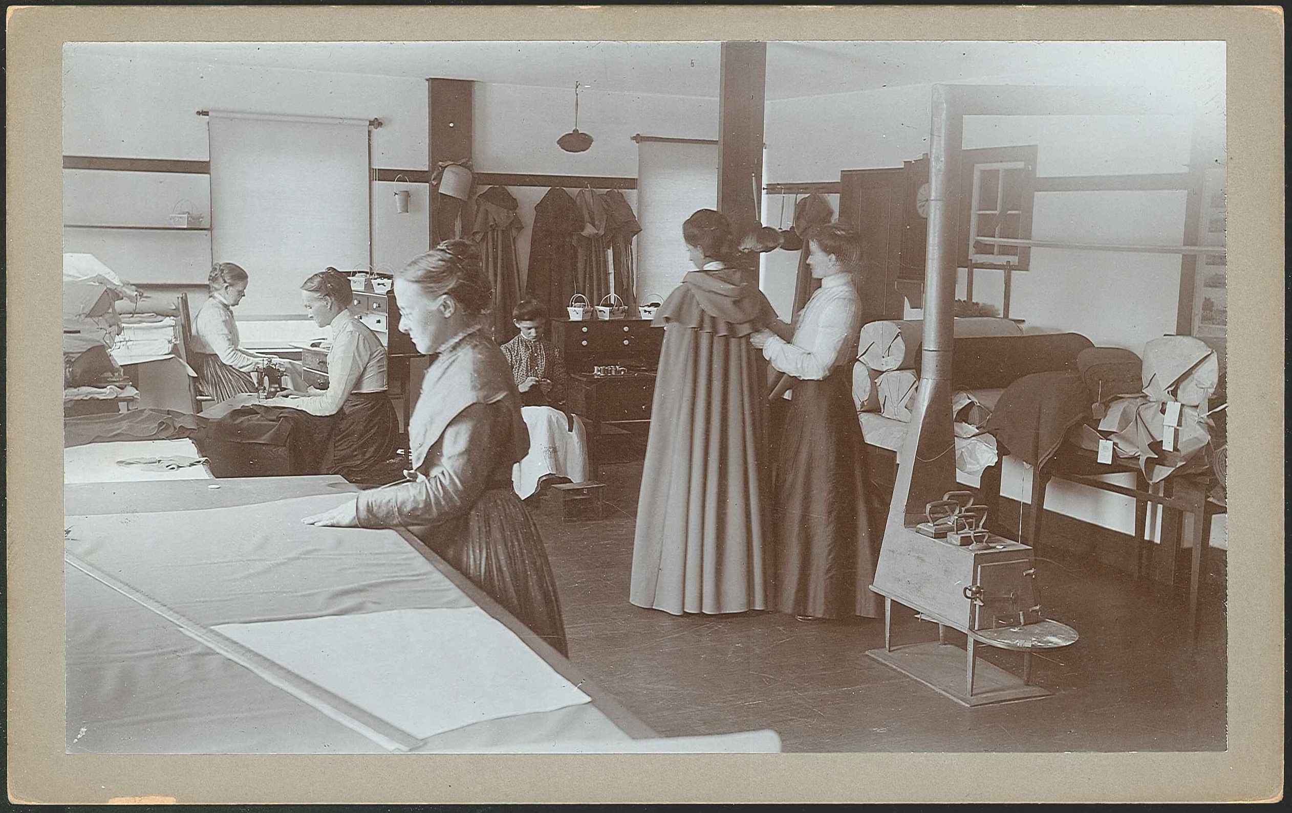 A group of women working in a sewing room.