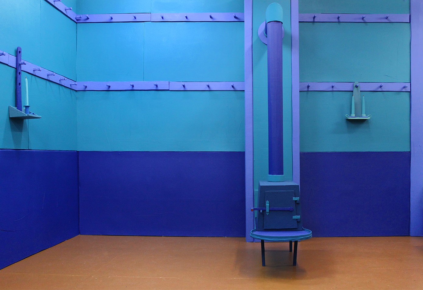 A room with blue walls and a bench.