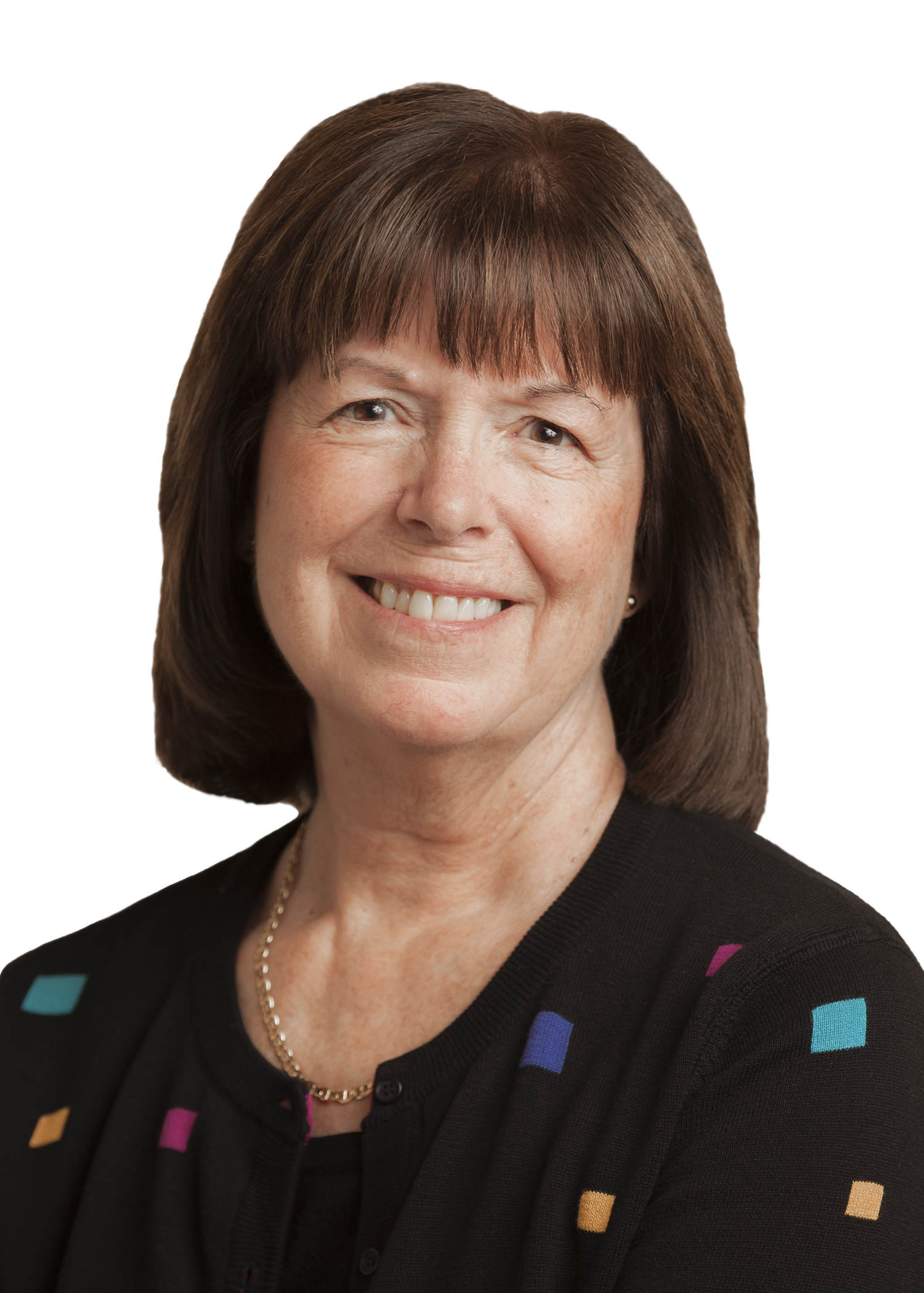 A woman with brown hair and a colorful sweater.