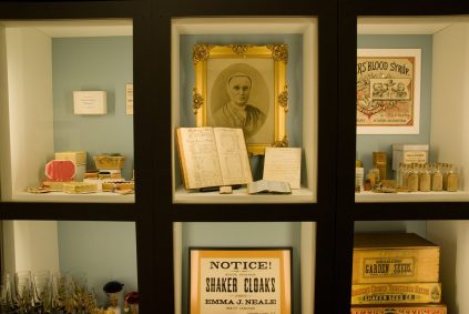 A display case with a lot of items in it.