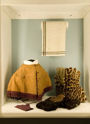 A display of hats, gloves and coats.