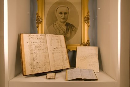 A book with a picture of a woman is on display.