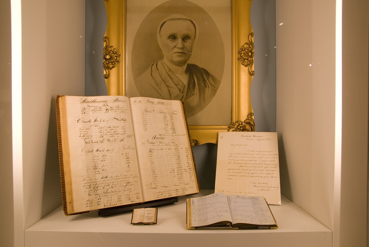 A book with a picture of a woman is on display.