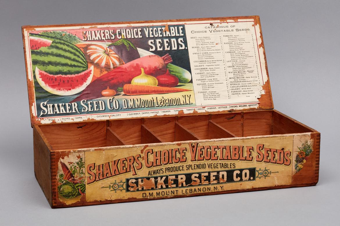 A wooden box with an advertisement for baker's seeds.