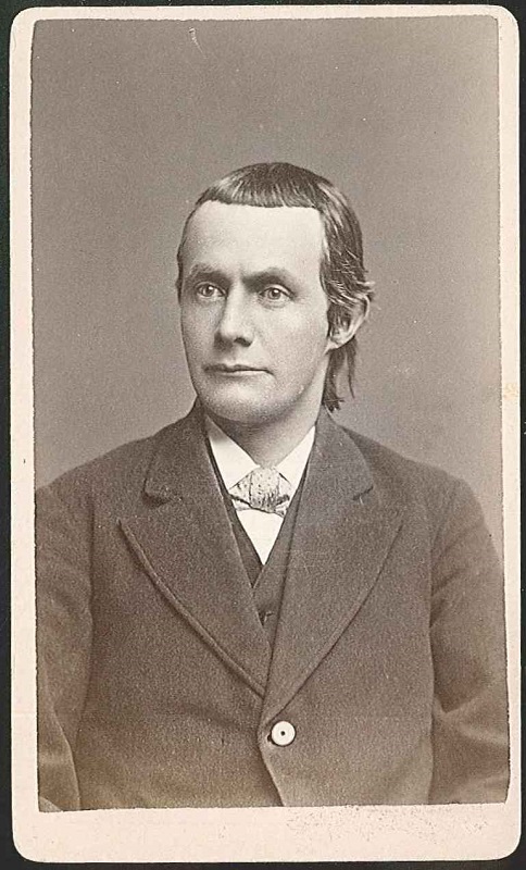 An old photograph of a man in a suit.