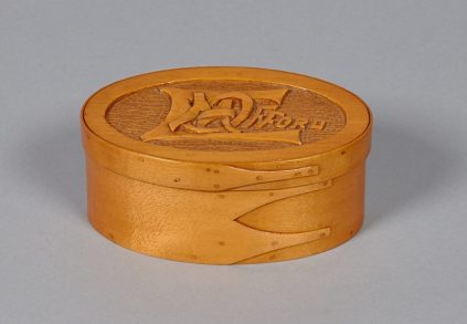 A wooden box with a logo on it.