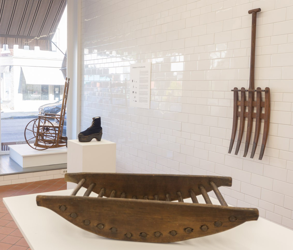 A wooden boat on display in a museum.