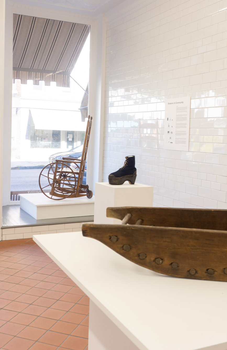 A wooden boat on display in a museum.