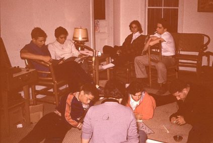 A group of people sitting in a living room.
