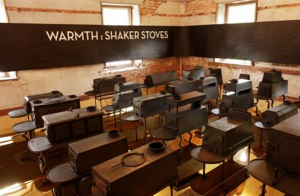 A room full of chairs and tables with the words warmth shakes stoves.