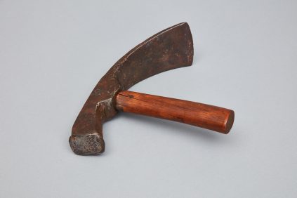 A small hammer with a wooden handle.