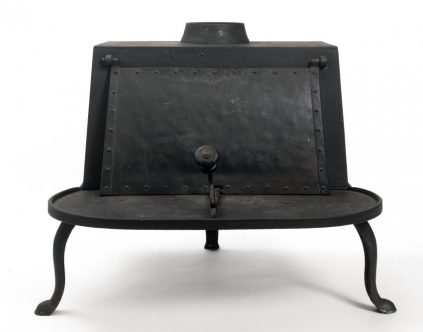 A black iron stove on a white background.