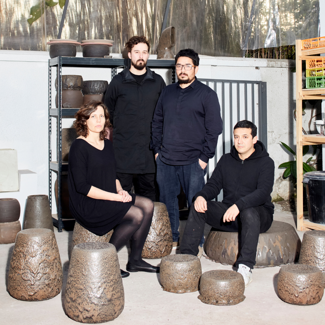 A group of people posing for a photo in a studio.