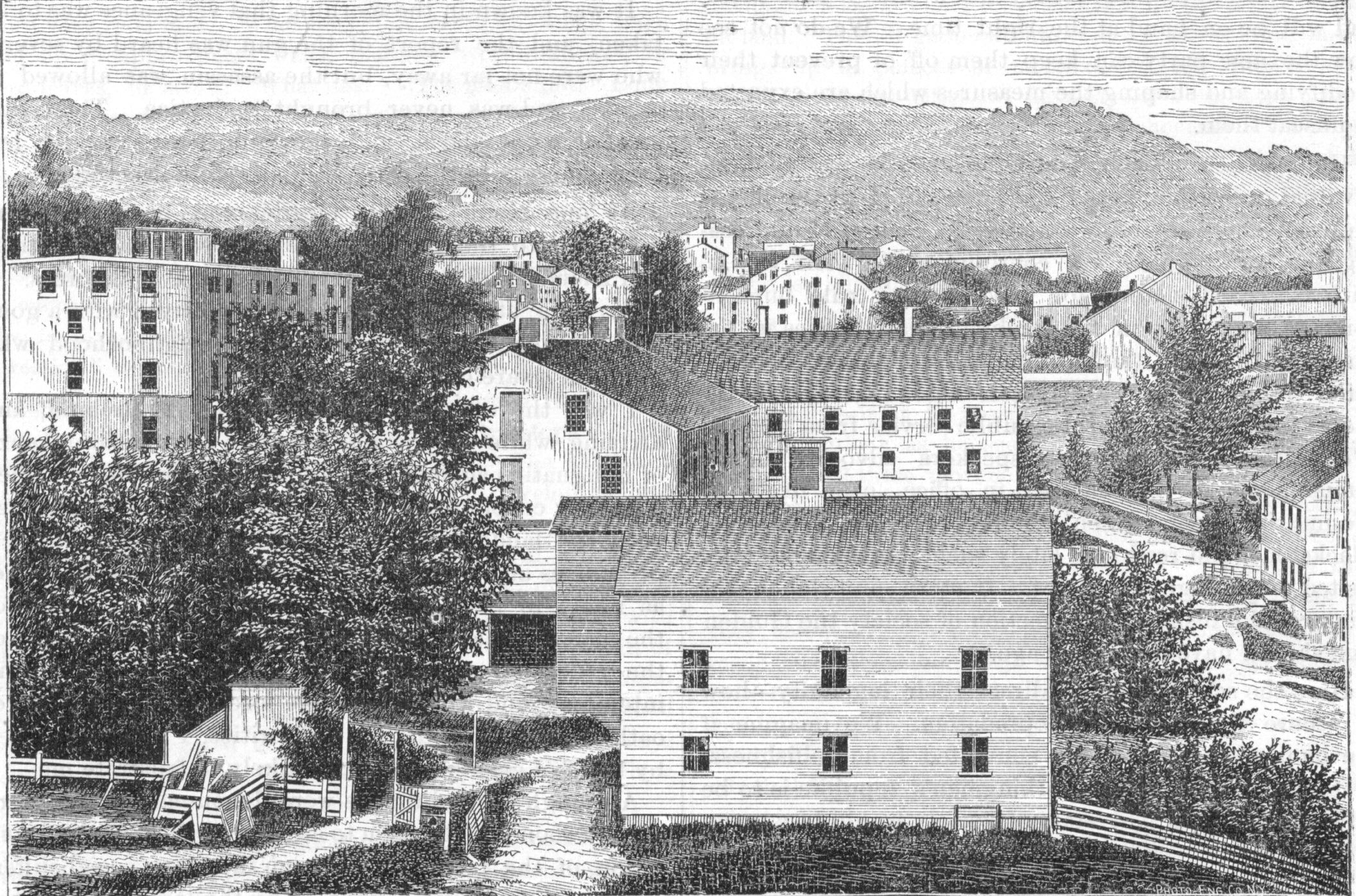 An old black and white drawing of a town.