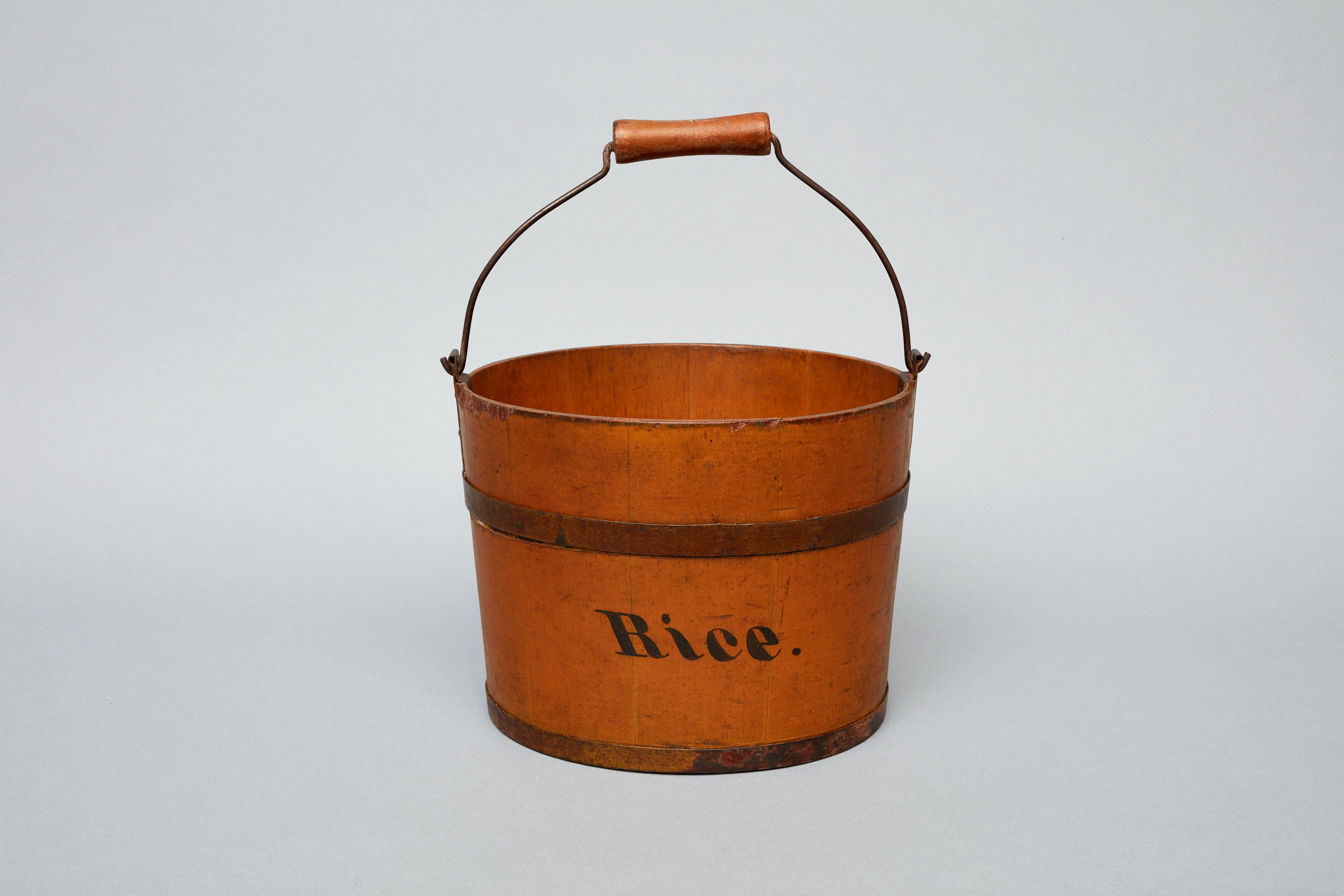 A brown bucket with the word rive on it.