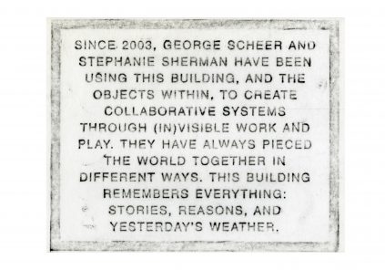 Text plaque describing the collaborative work of george scheer and stephanie sherman since 2003, highlighting their different approaches to remembering everything including stories and the weather.